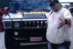 A chubby Dj Poroufessor standing in front of the H2 FLAVA Hummer...word is this beast will be kitted with Turntables in the near future...when they make some room in the back next to the 12 subs/PS2 and cappuchino machine in the boot.. Tune in for your dose of Hiphop n RNB..96.1 FM 

